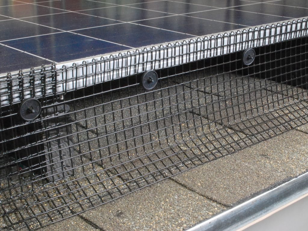 Close up of bird proofing mesh fitted to the edge of a solar panel